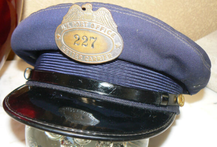 Vintage US Post Office letter carrier cap with badge number 227