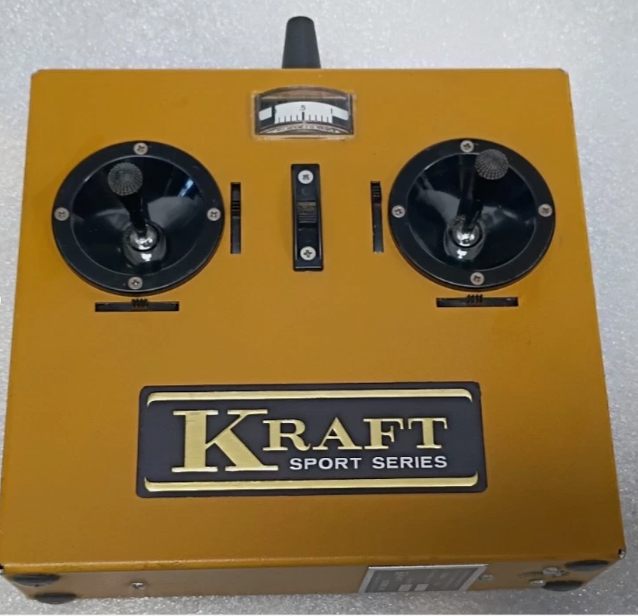 Vintage Kraft Sport Series R/C radio transmitter in gold with dual joystick controls and analog meter