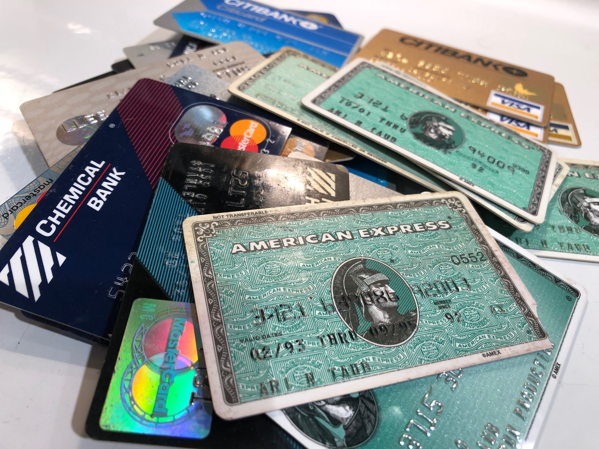 Collection of vintage credit cards including American Express, Visa, MasterCard, and Chemical Bank