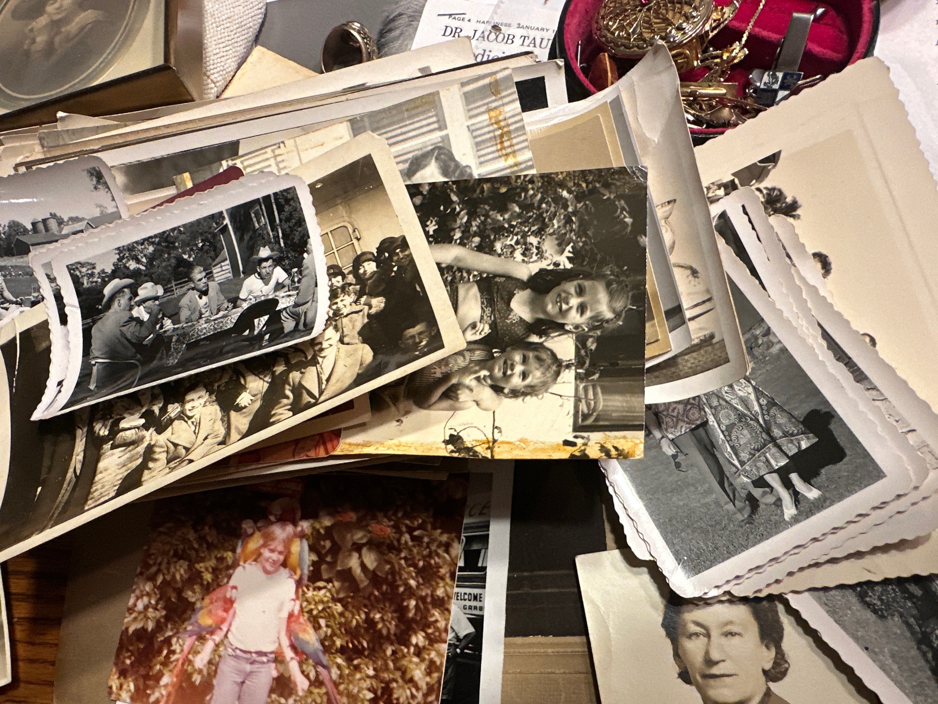 Collection of vintage black-and-white and color photographs from the 1930s–1950s scattered together
