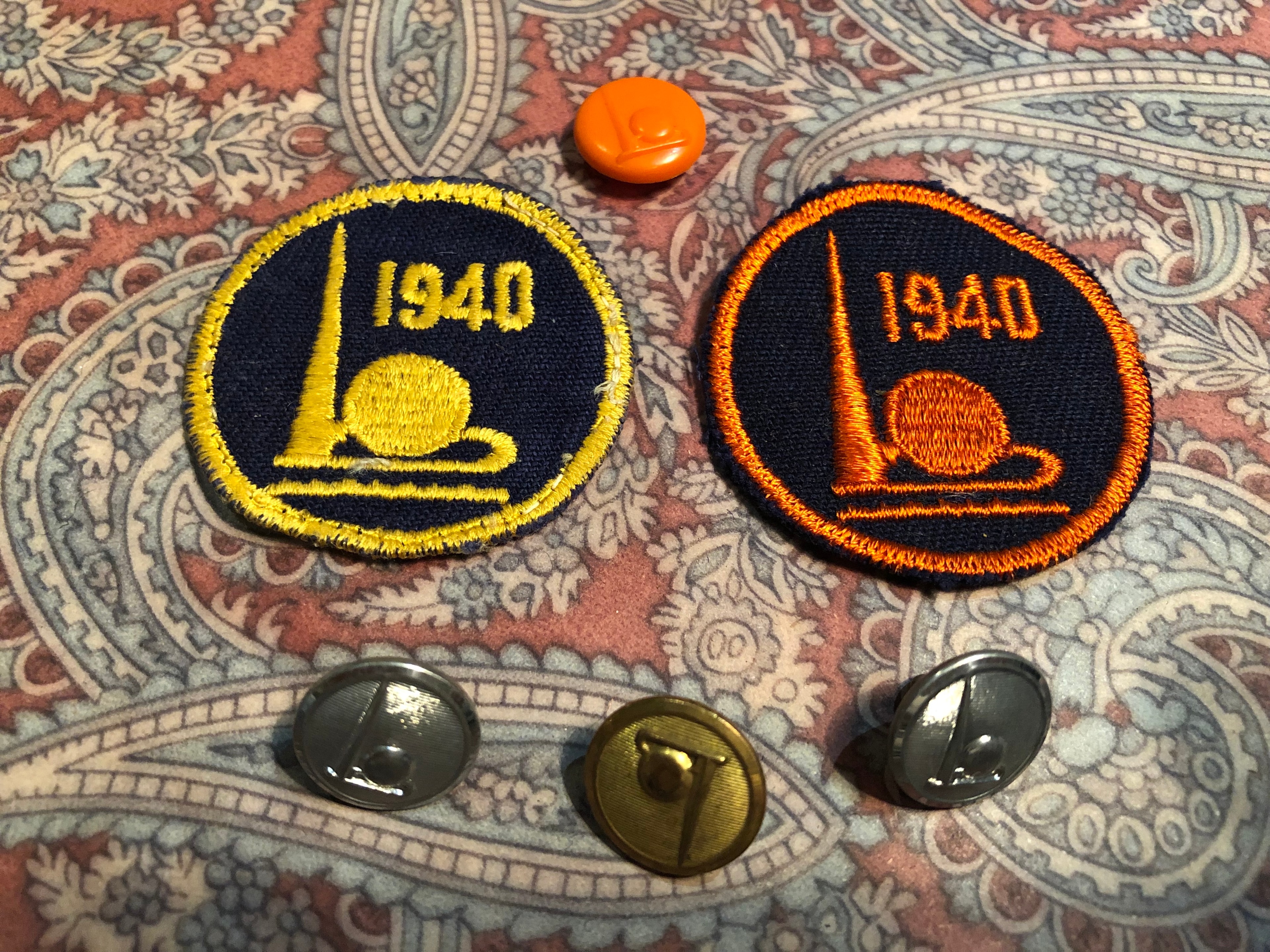 1940 World's Fair circular embroidered patches and lapel pins with Trylon and Perisphere
